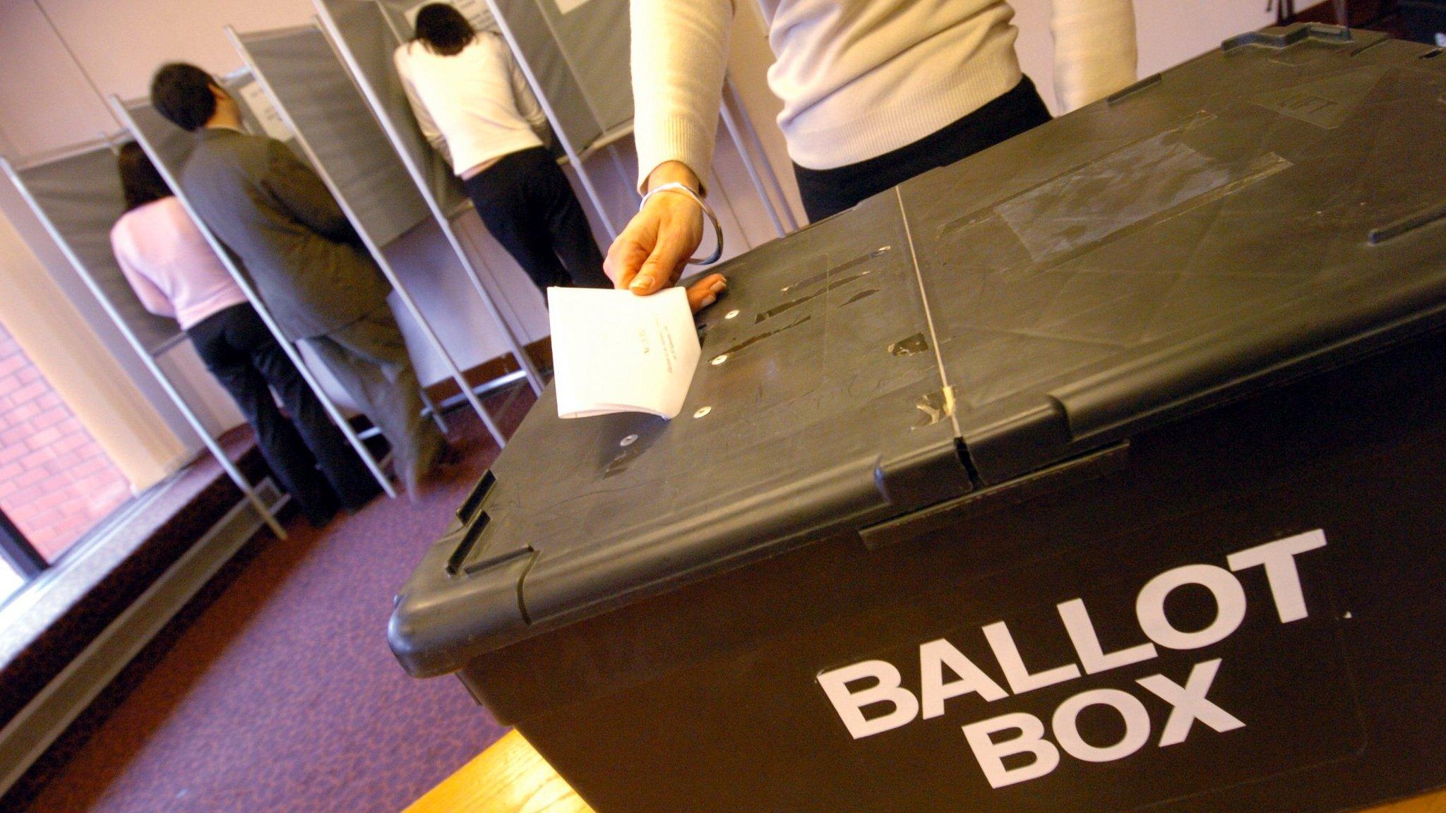 A polling booth and ballot box