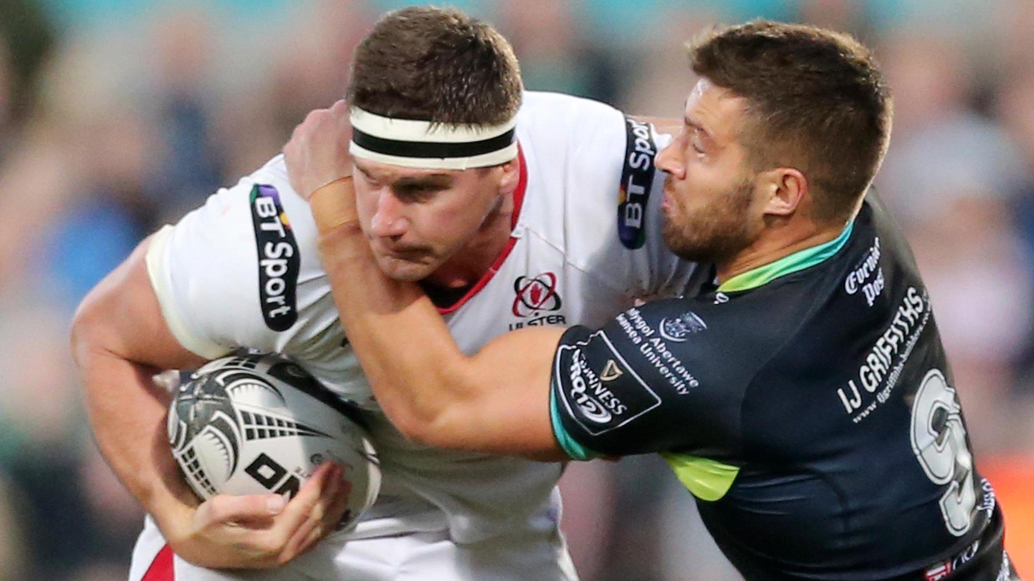 Ulster forward Robbie Diack is challanged by Ospreys scrum-half Rhys Webb