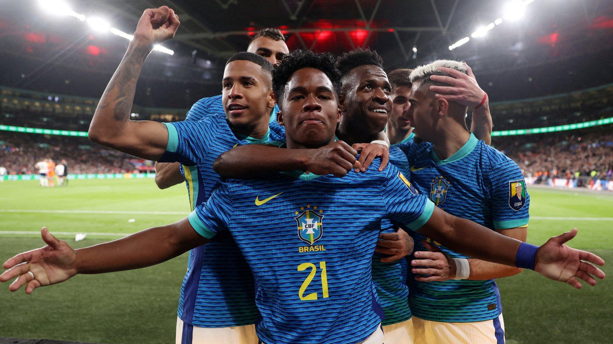 Endrick celebrating his goal against England with his team-mates