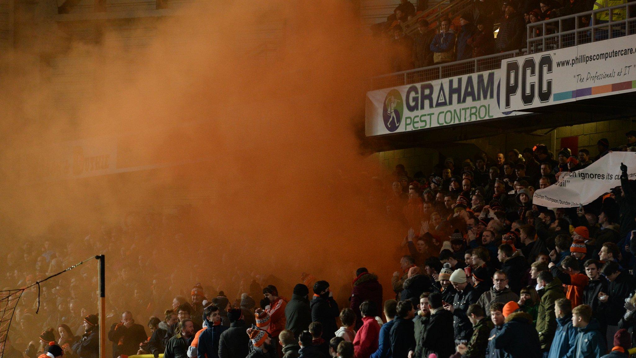 A flare goes off at Tannadice