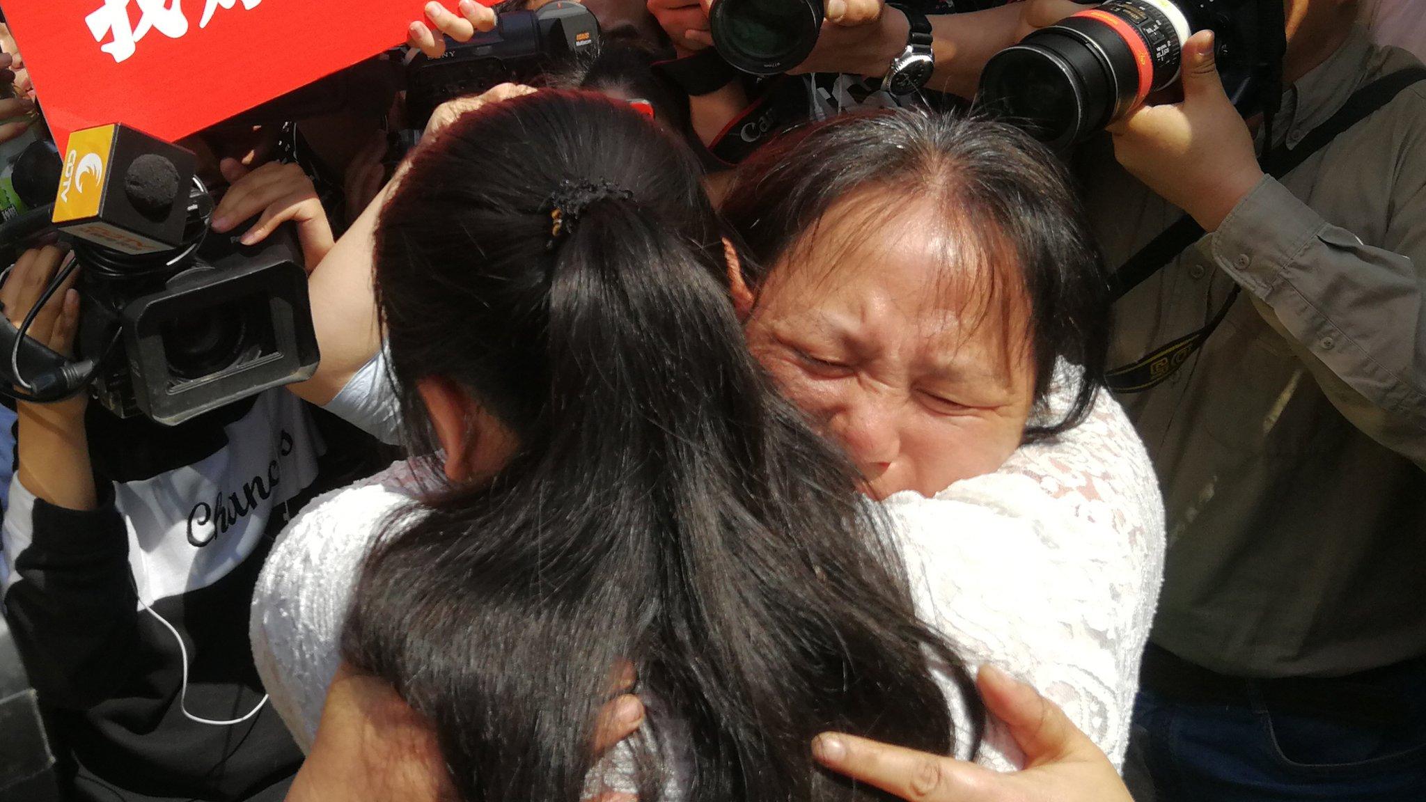 Kang Ying and her mother Liu Dengying hug after being reunited