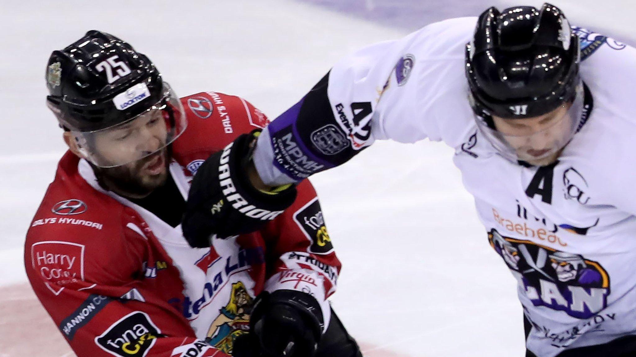 Belfast's Blair Riley battles with Braehead's Brendan Brooks in Sasturday's game at the SSE Arena