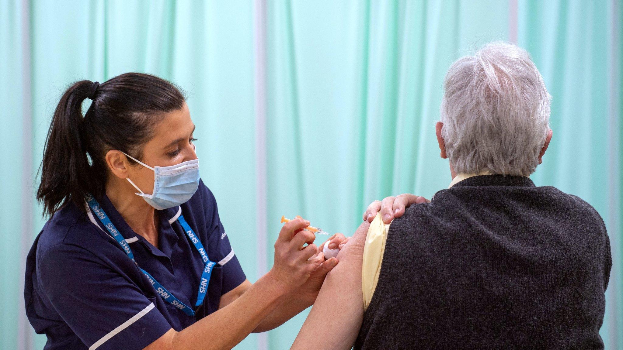 Woman receiving Covid jab in Stevenage