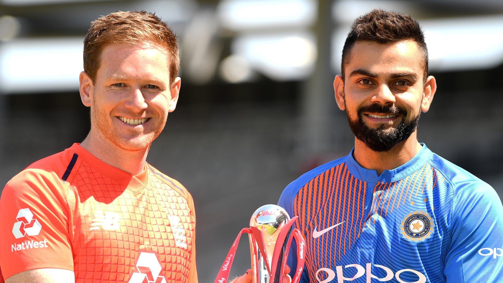 England captain Eoin Morgan and India captain Virat Kohli hold up the T20 series trophy