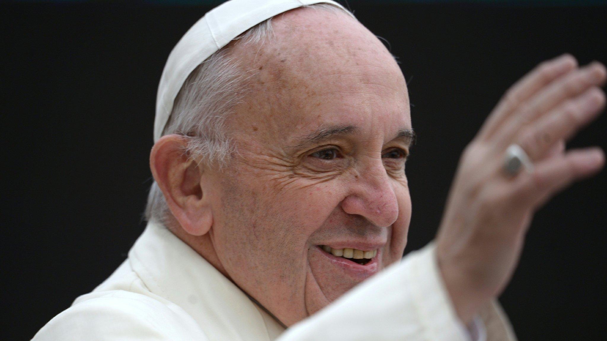 Pope Francis salutes crowd in St Peter's Square, Rome, for weekly general audience. 23 March 2016