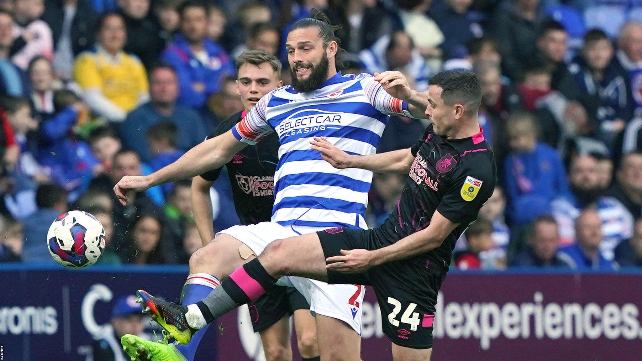 Reading's Andy Carroll (centre) in action during the Championship match against Burnley at the Select Car Leasing Stadium, Reading