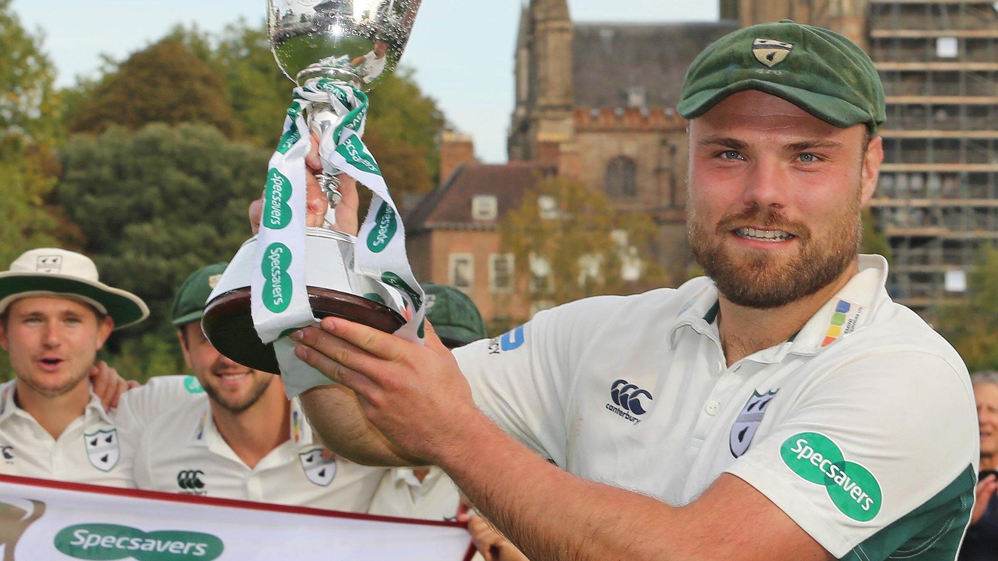 Worcestershire captain Joe Leach lifts the Division Two title