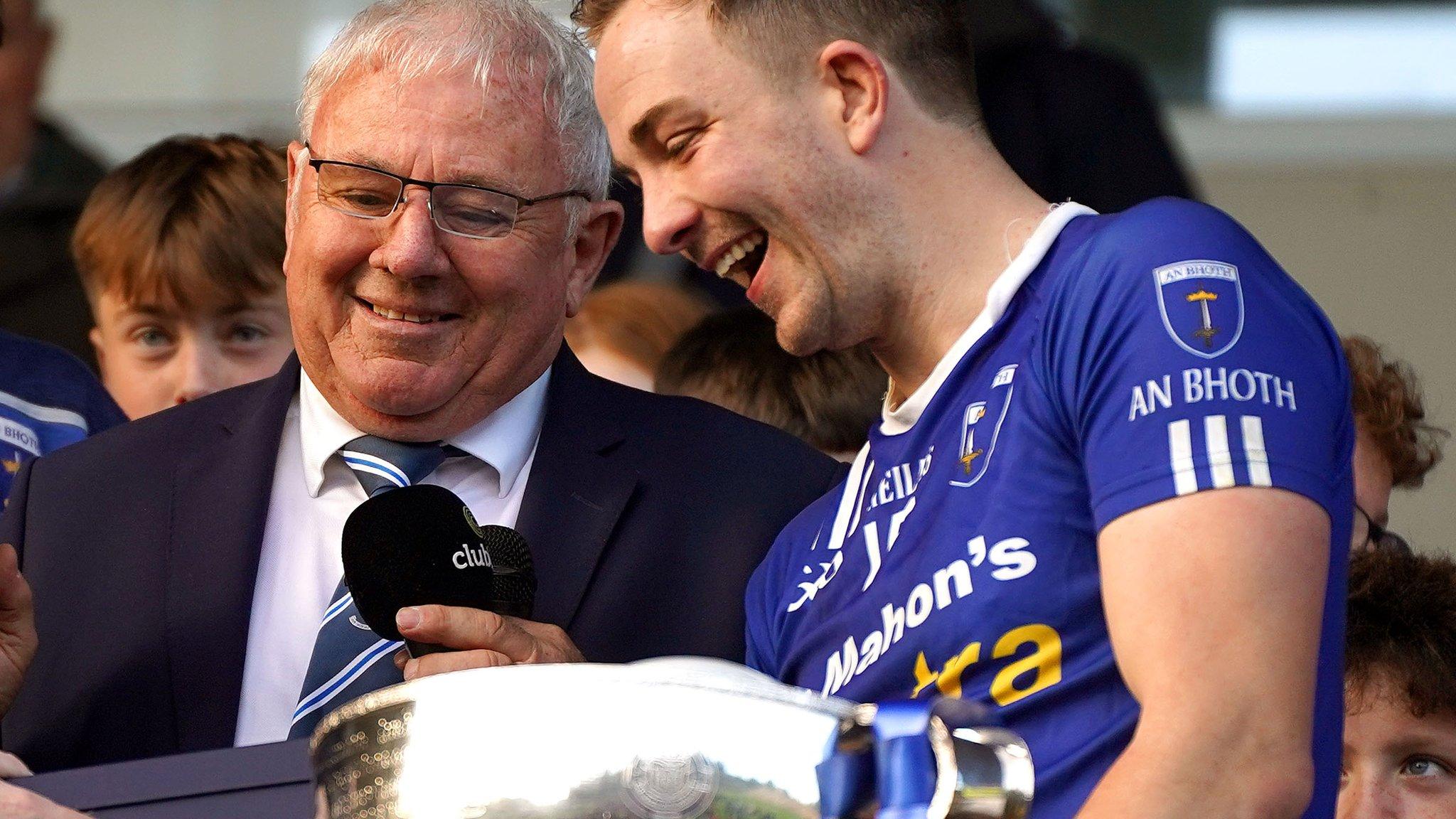 Jack McCarron is presented with the player of the match trophy after Scotstown's Monaghan SFC final win over Iniskeen