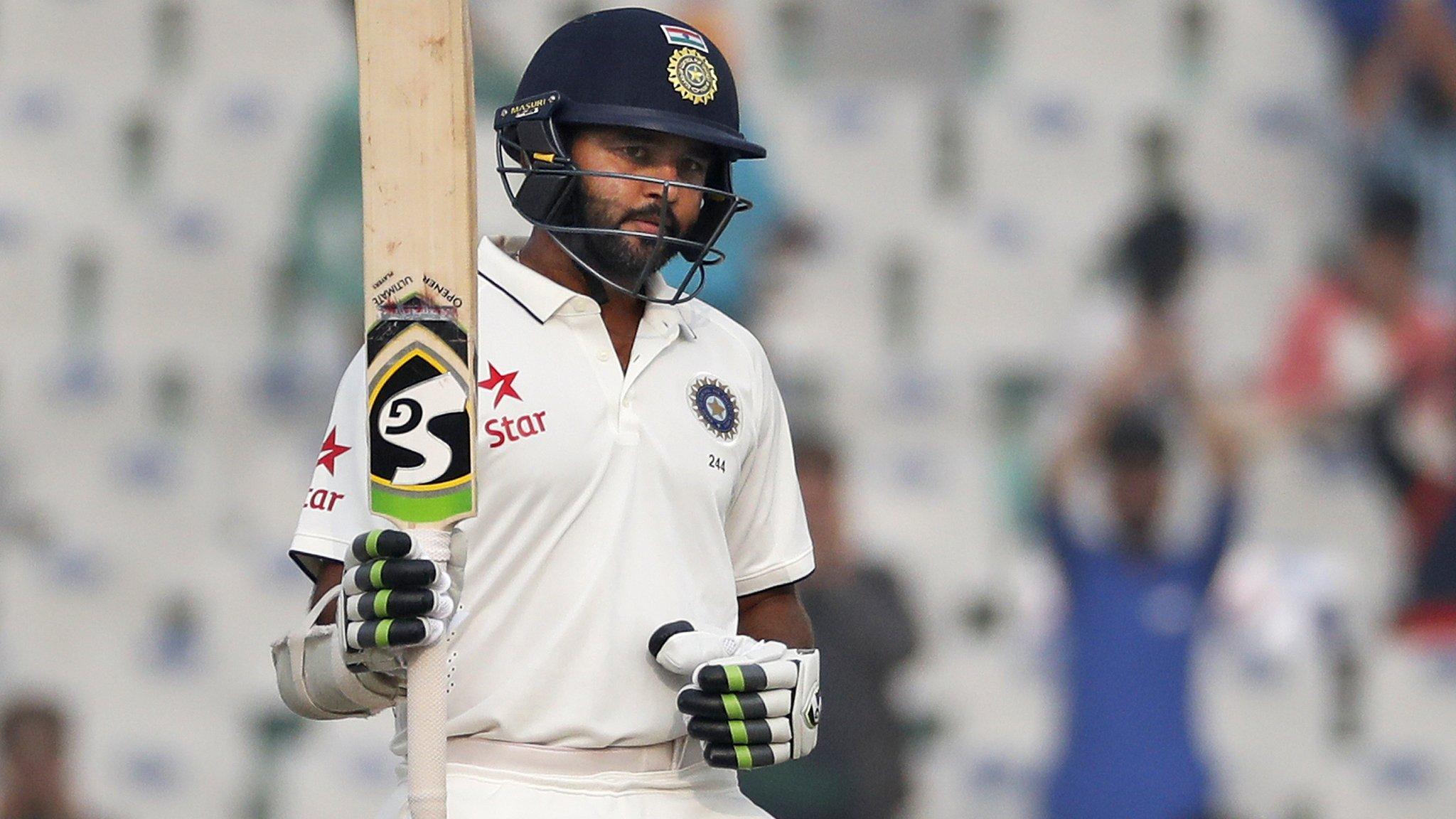 Parthiv Patel raises his bat