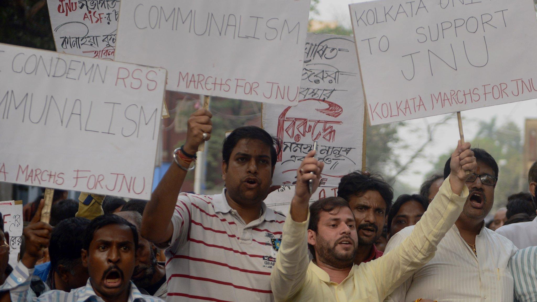 Indian Congress and Leftist activists shout slogans again the ruling Bharatiya Janata Party (BJP) government during a joint protest against the arrest of a student from Jawaharlal Nehru University (JNU) in Kolkata on February 15, 2016.