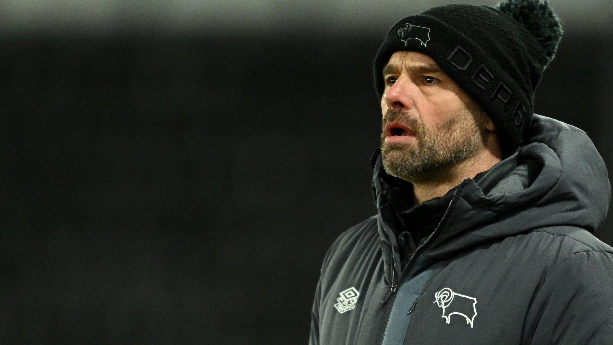 Paul Warne watches his Derby team from the side of the pitch