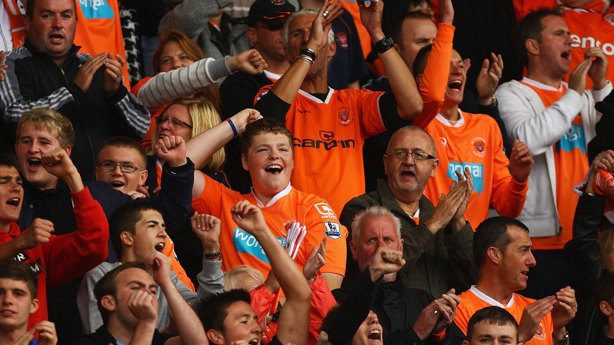 Blackpool fans cheer their side on at Bloomfield Road in the Premier League