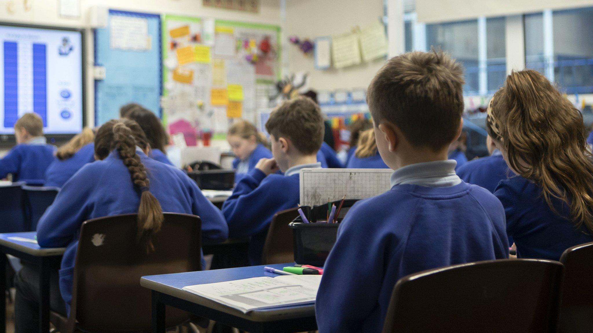 A school classroom where children are studying