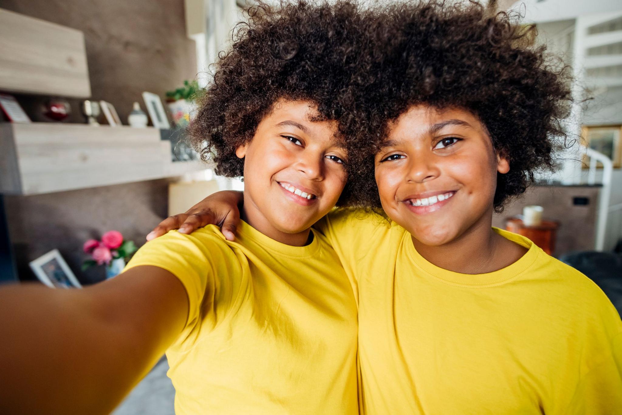 Twin boys in yellow t-shirts