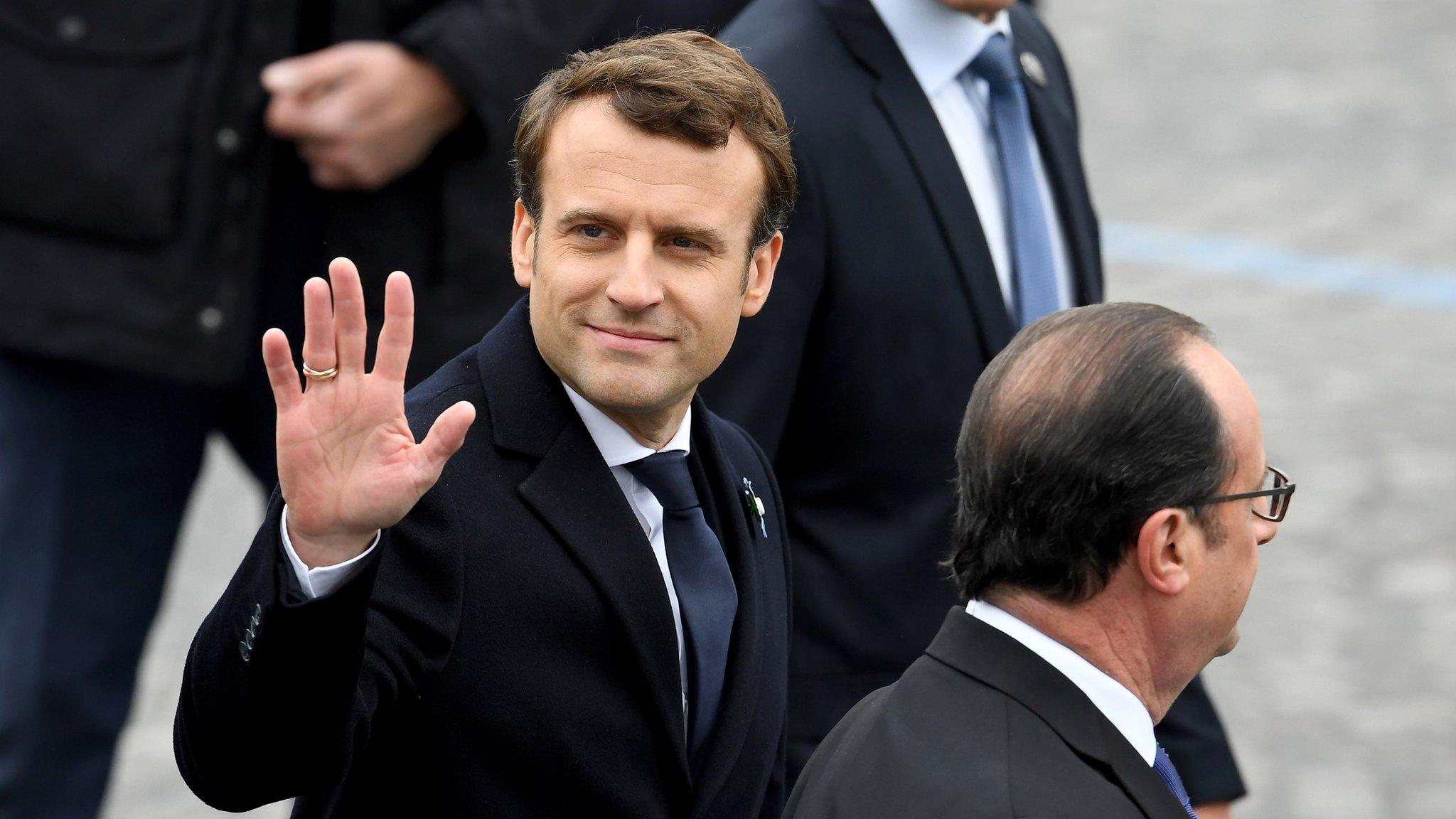 French president-elect Emmanuel Macron and the outgoing French President Francois Hollande at a ceremony marking allies' World War Two victory