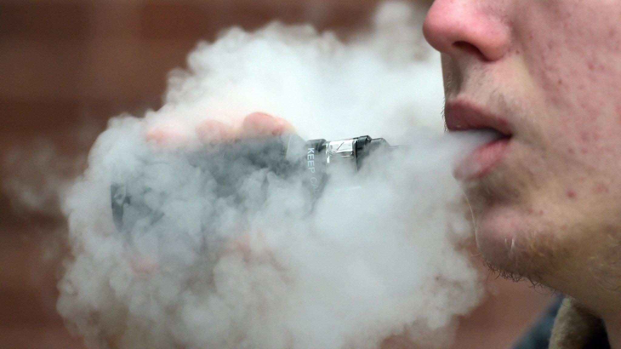 Young man vaping