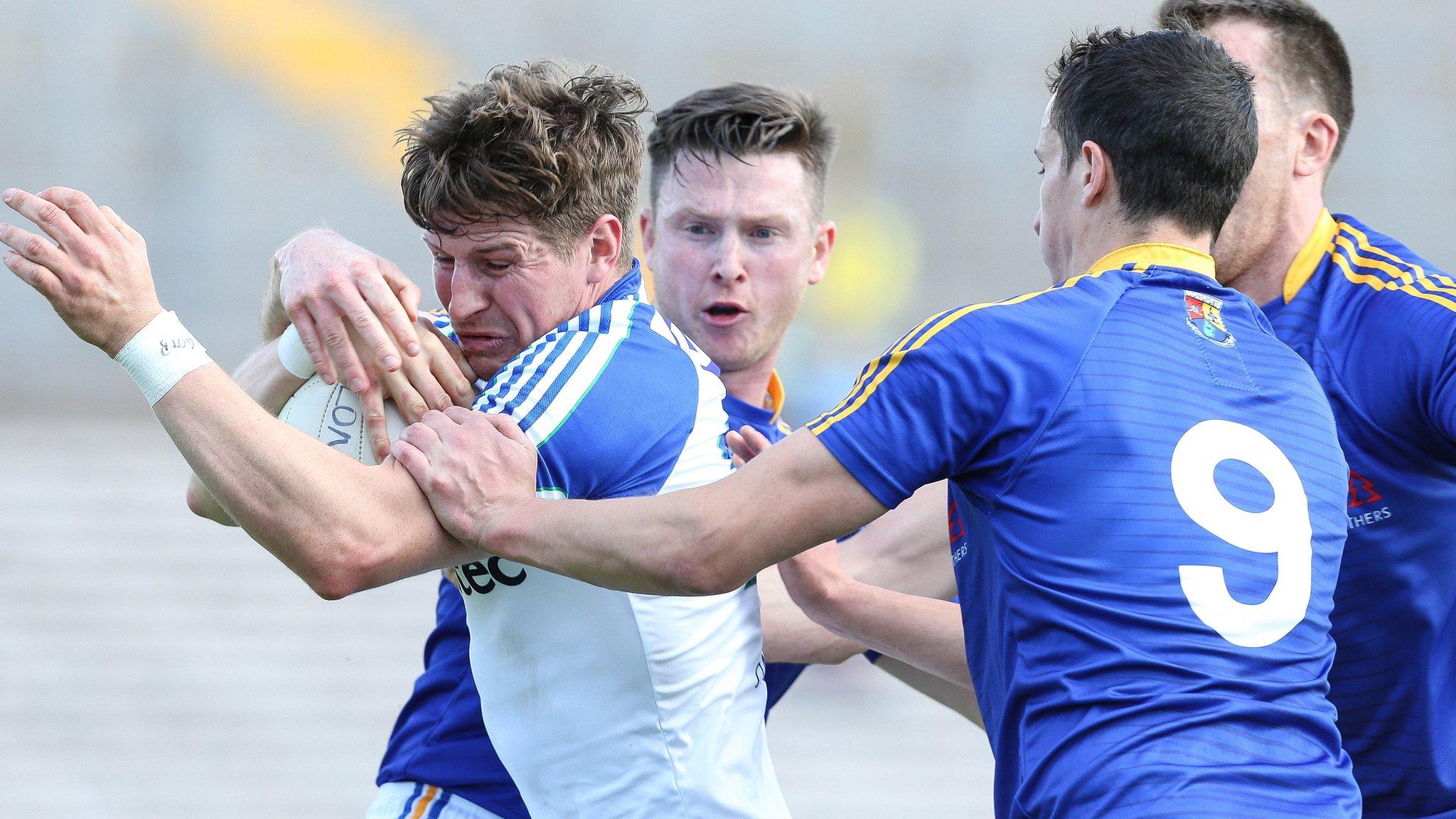 Monaghan forward Darren Hughes is challenged by three Longford players