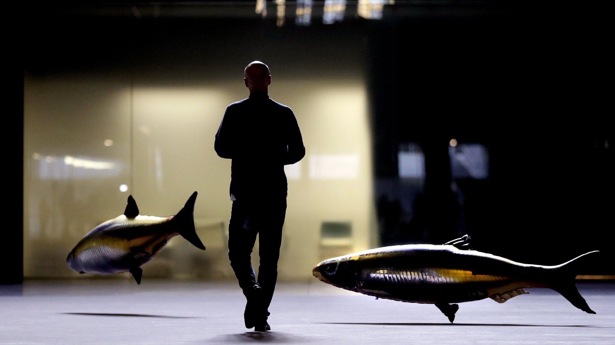 French artist Philippe Parreno with his floating fish in the Turbine Hall at Tate Modern