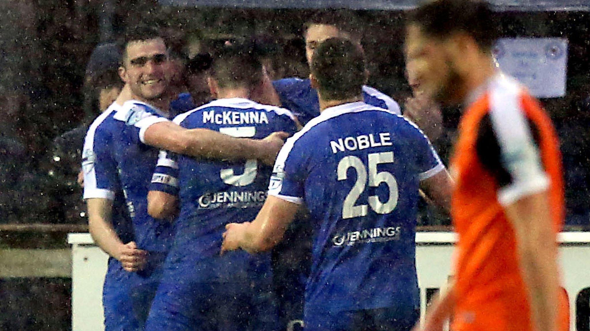 Ballinammallard celebrate scoring the opener against Carrick