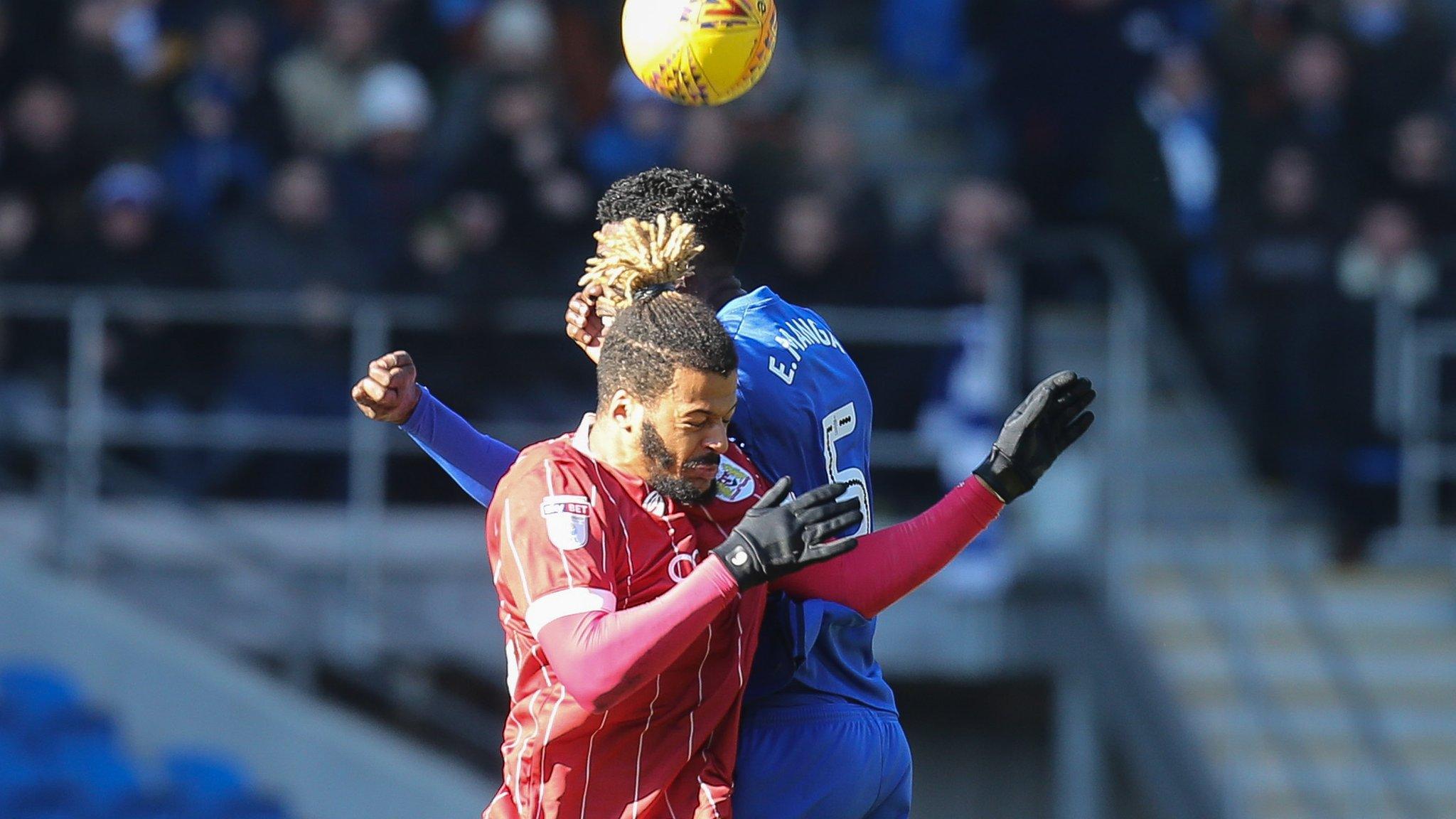 Bruno Ecuele Manga of Cardiff City and Lois Diony of Bristol City compete for the (aerial) ball