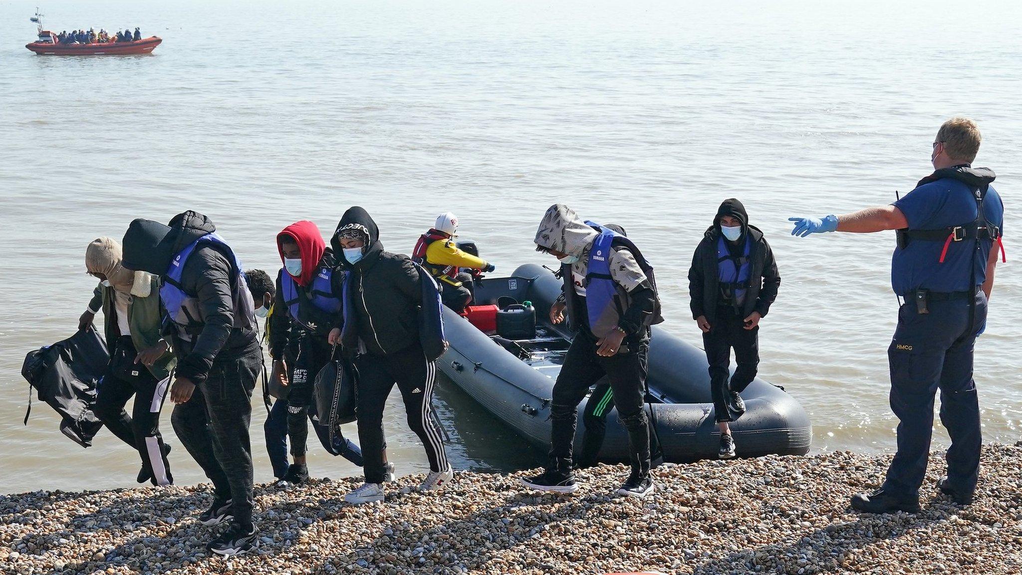 People being escorted to shore