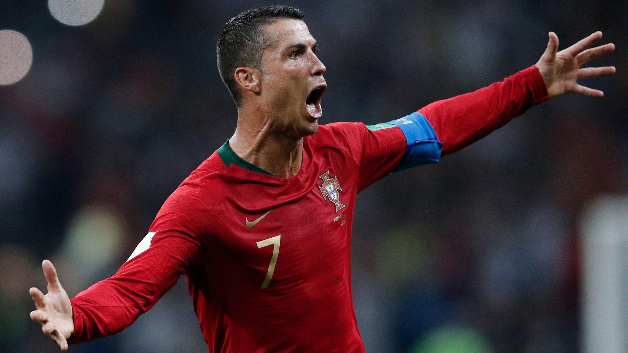 Cristiano Ronaldo celebrates scoring Portugal's third goal against Spain