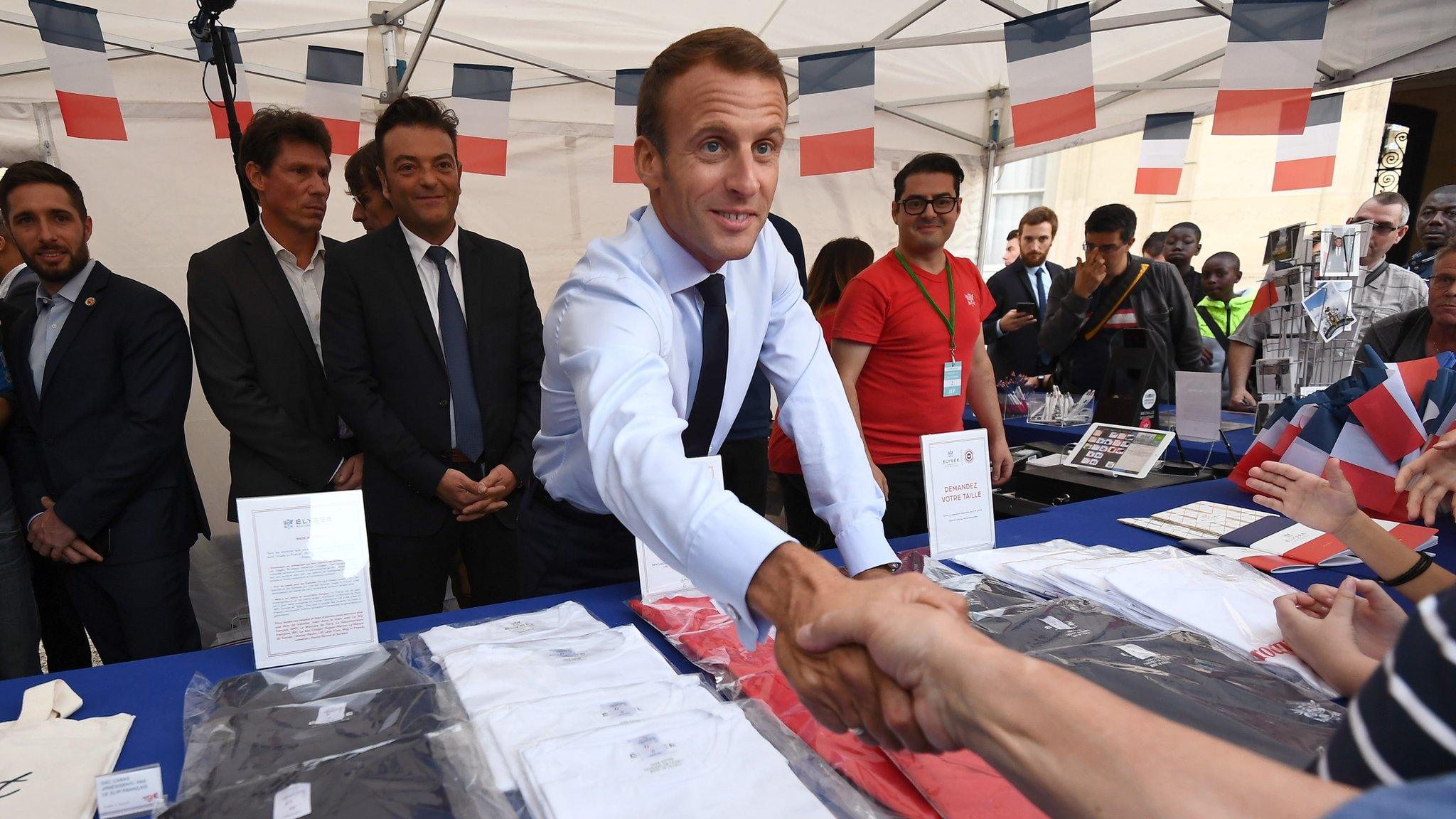 President Emmanuel Macron shakes hands with a visitor at the Elysee Palace in Paris, 15 September 2018.