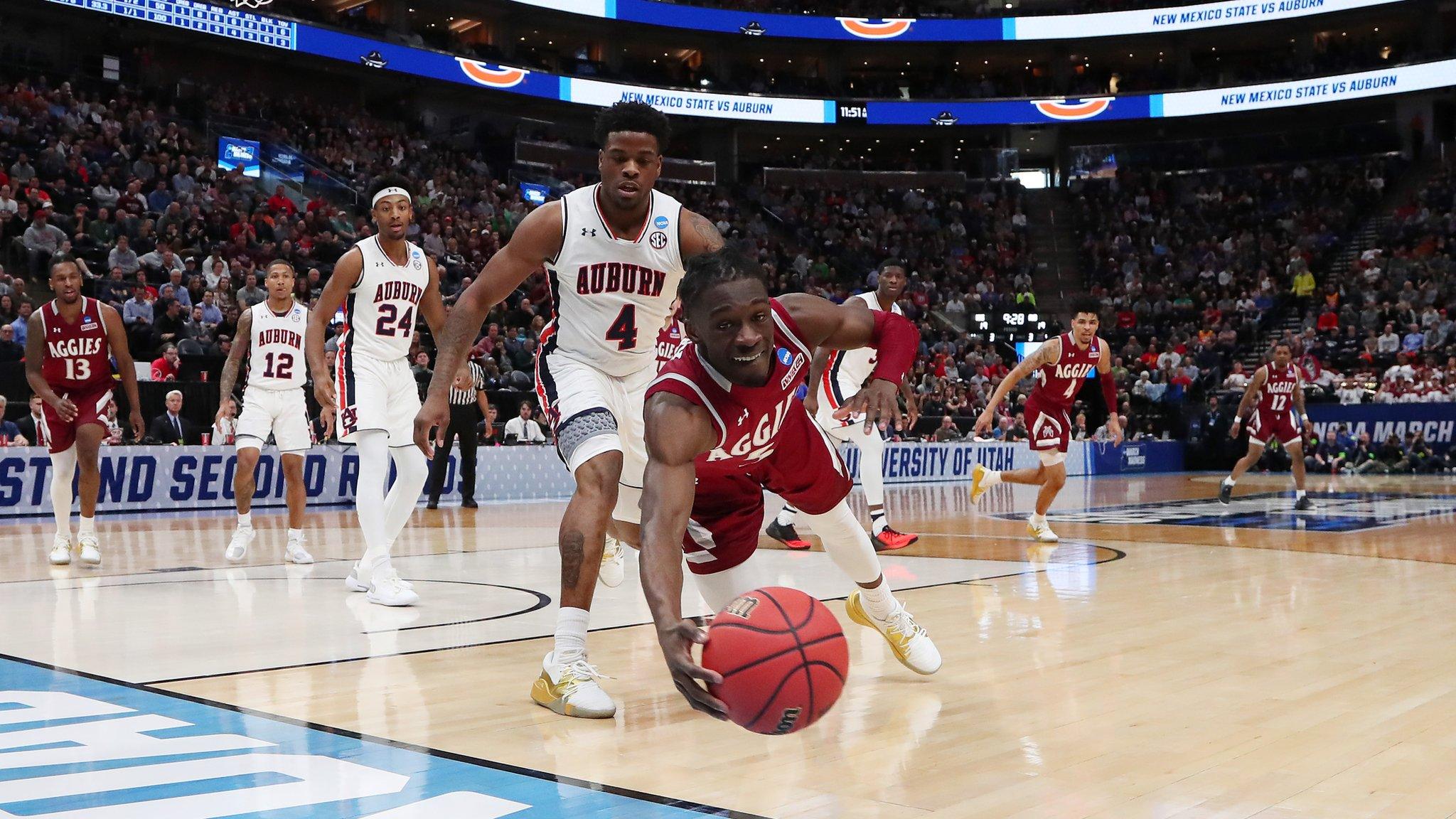 Clayton Henry #5 of the New Mexico State Aggies dives for the ball during the first half against the Auburn Tigers in the first round of the 2019 NCAA Men's Basketball Tournament at Vivint Smart Home Arena on March 21, 2019 in Salt Lake City, Utah. (Photo by Tom Pennington/Getty Images)