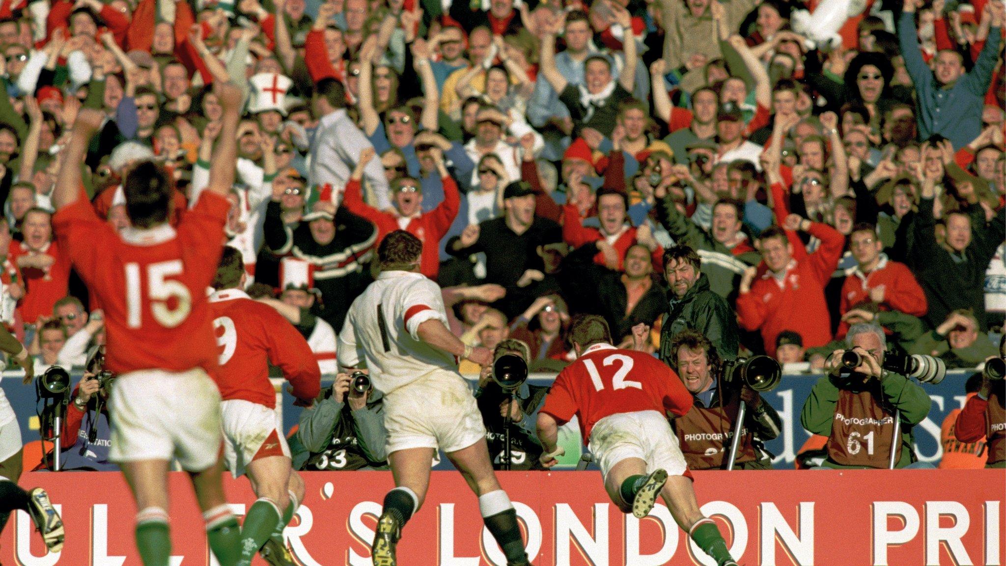 Scott Gibbs goes over for a dramatic late try for Wales and the Welsh fans celebrate