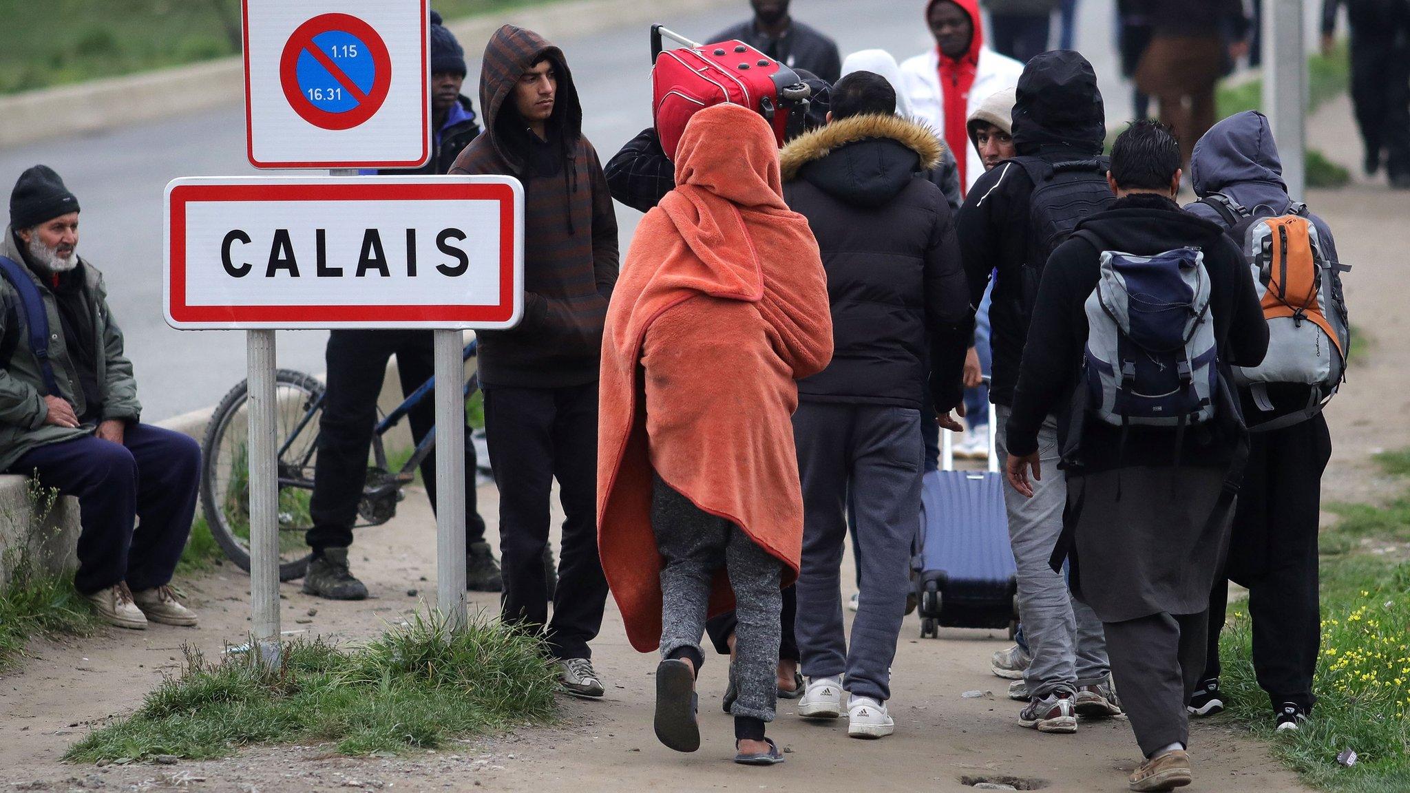 Migrants leaving the camp