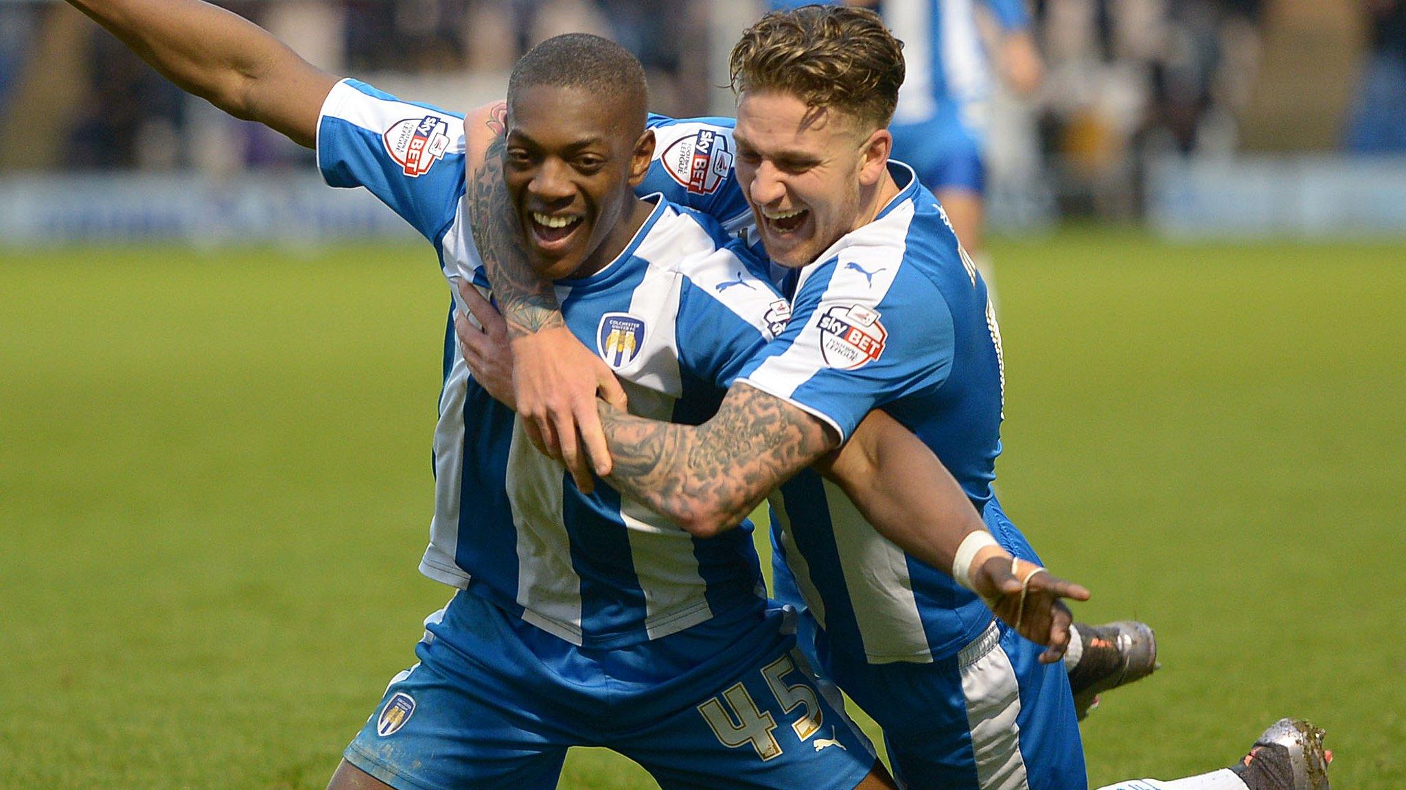 Marvin Sordell celebrates scoring Colchester's second with George Moncur