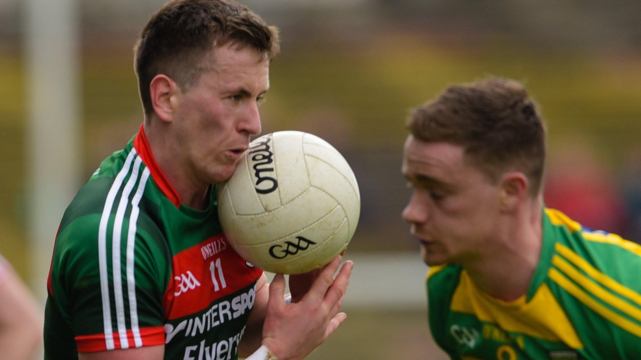 Mayo's Cillian O'Connor and Ciaran Thompson of Donegal