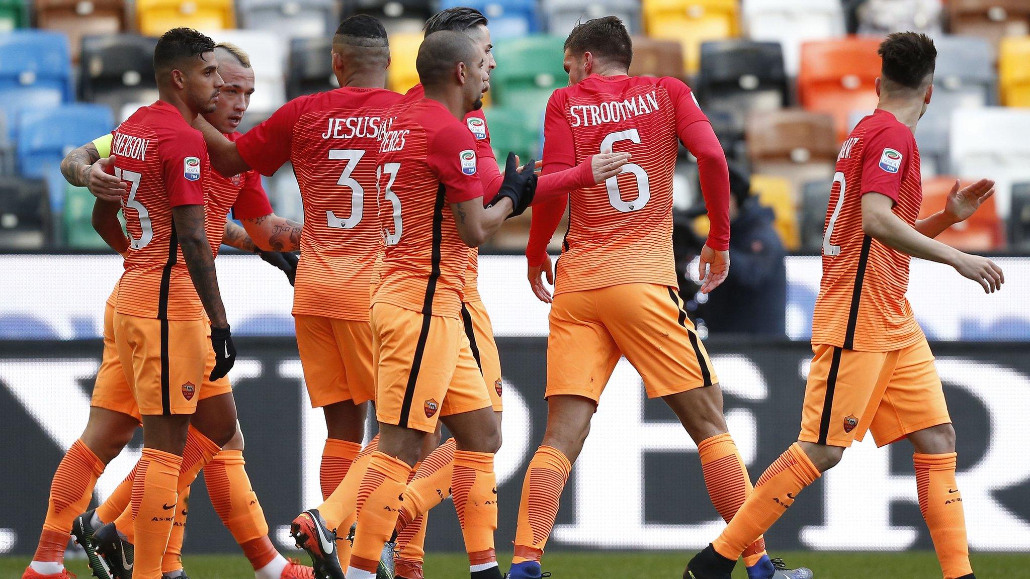 Roma's players celebrate scoring against Udinese