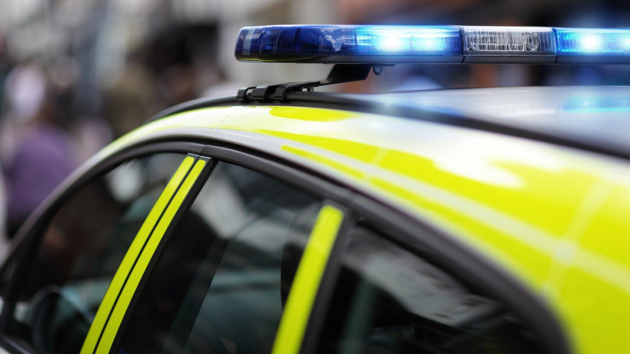 A police car with its lights flashing