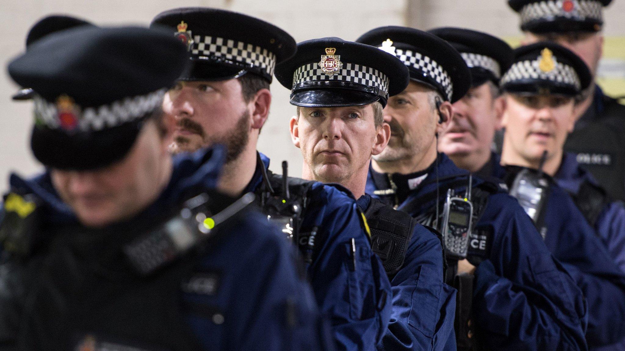 Police waiting to go out on duty at a football match