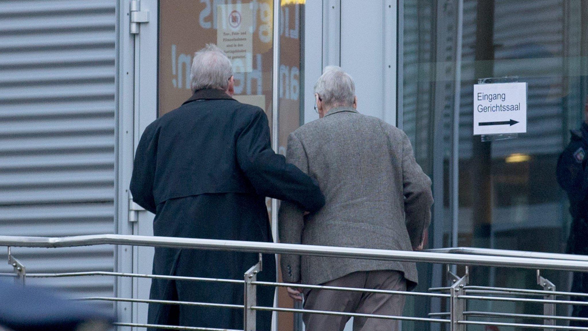 Defendant Reinhold H. (R) is brought to the Chamber of Industry and Commerce (IHK) building in Detmold, Germany (11 February 2016)