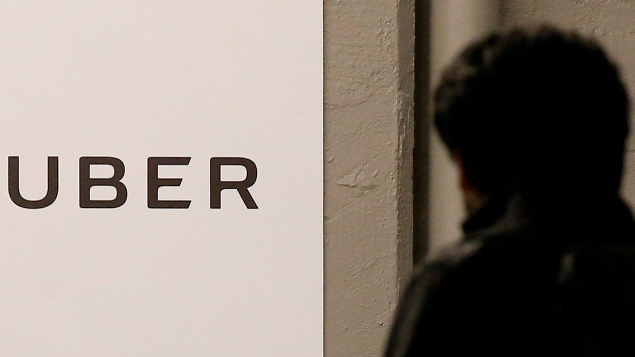 A man arrives at the Uber offices in Queens, New York, US, 2 February 2017