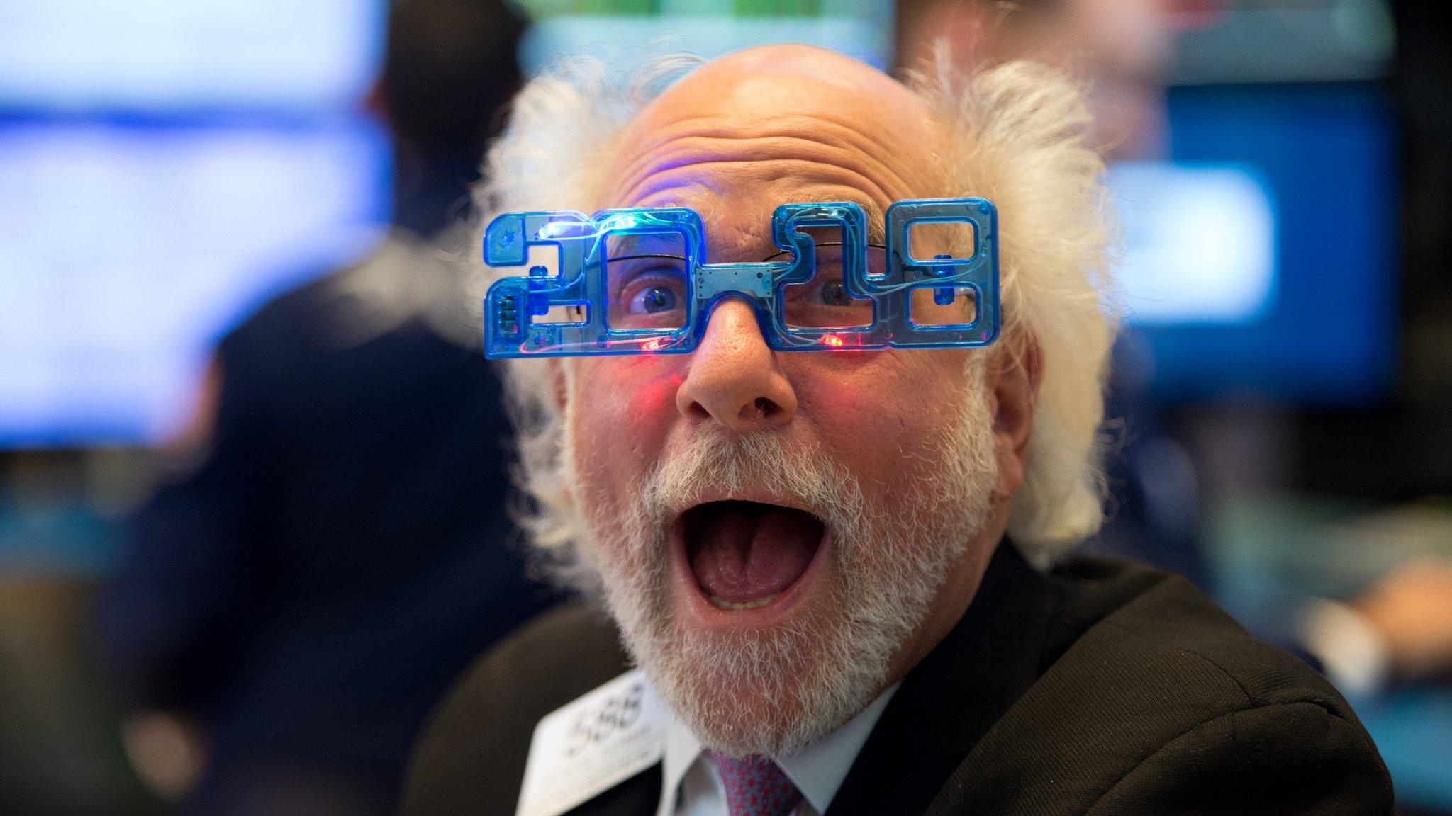 A trader works on the floor at the closing bell of the Dow Industrial Average at the New York Stock Exchange on December 29, 2017 in New York.