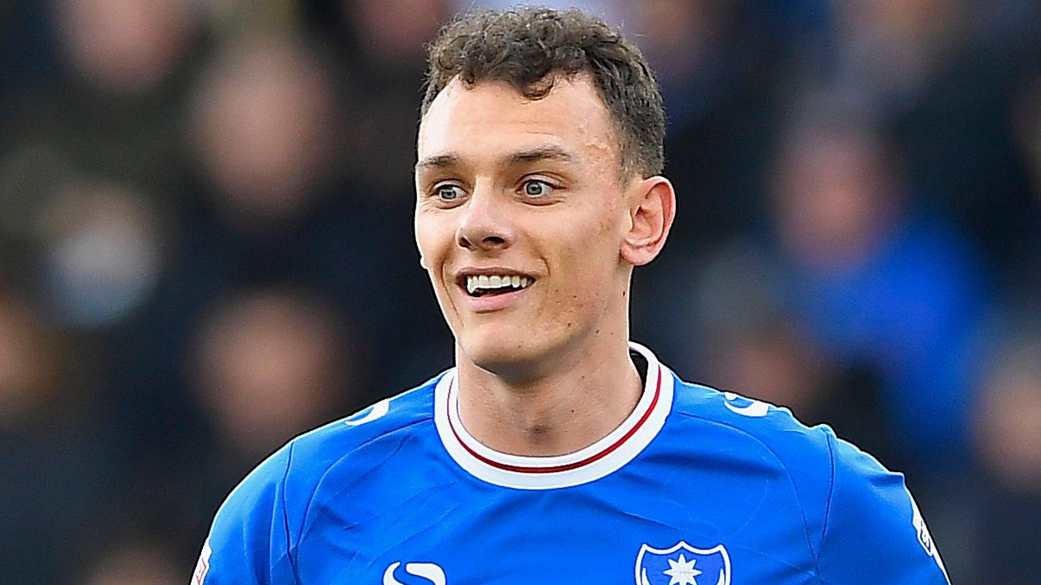 Kal Naismith smiles after scoring for Portsmouth against Oxford United