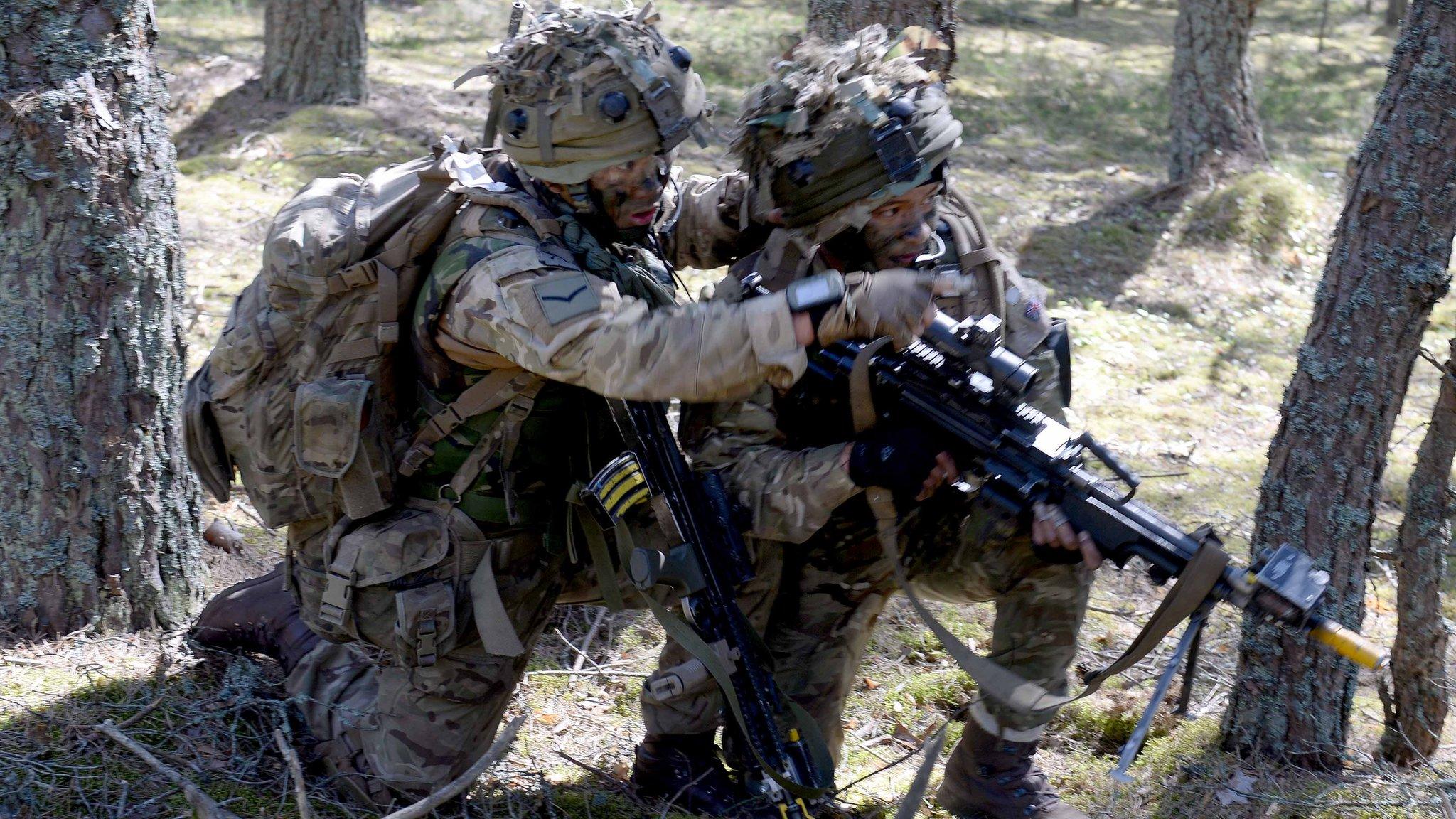 UK soldiers take part in a military exercise in an undisclosed location on June 10, 2015 in Latvia