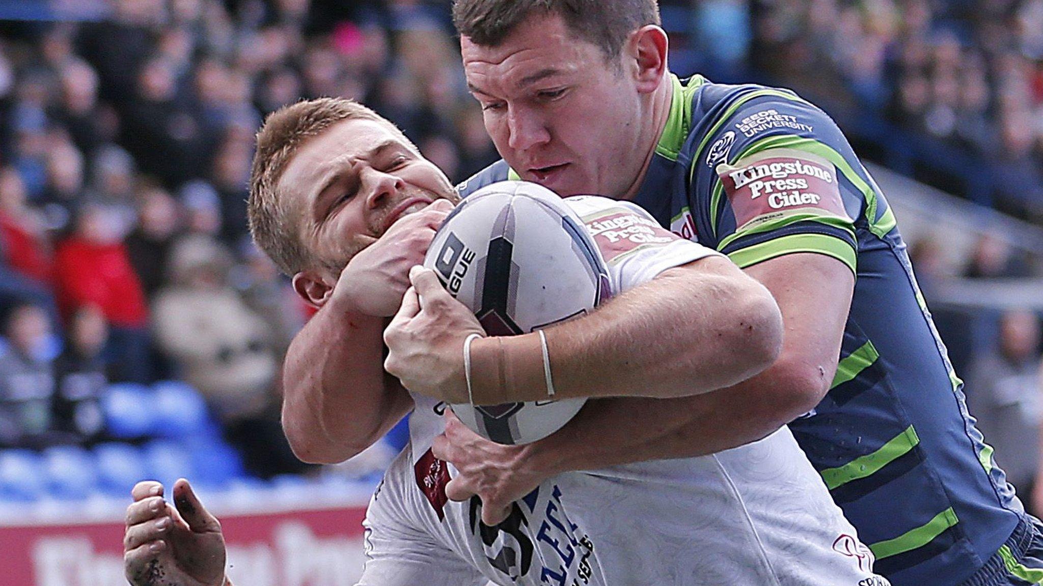 Leeds' Brett Ferris hold on to Widnes' Rhys Hanbury