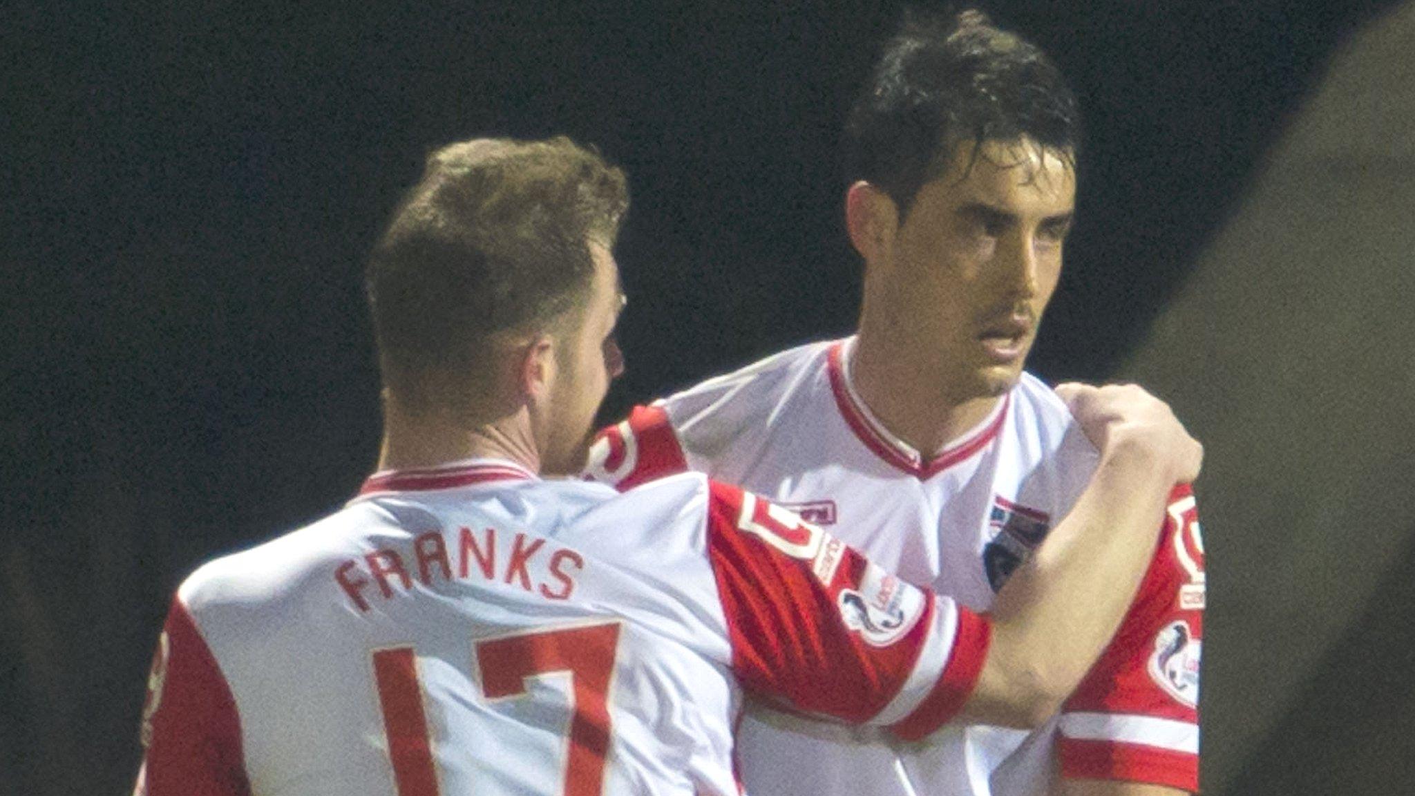 Jonathan Franks helps Brian Graham (right) celebrate his equalising penalty