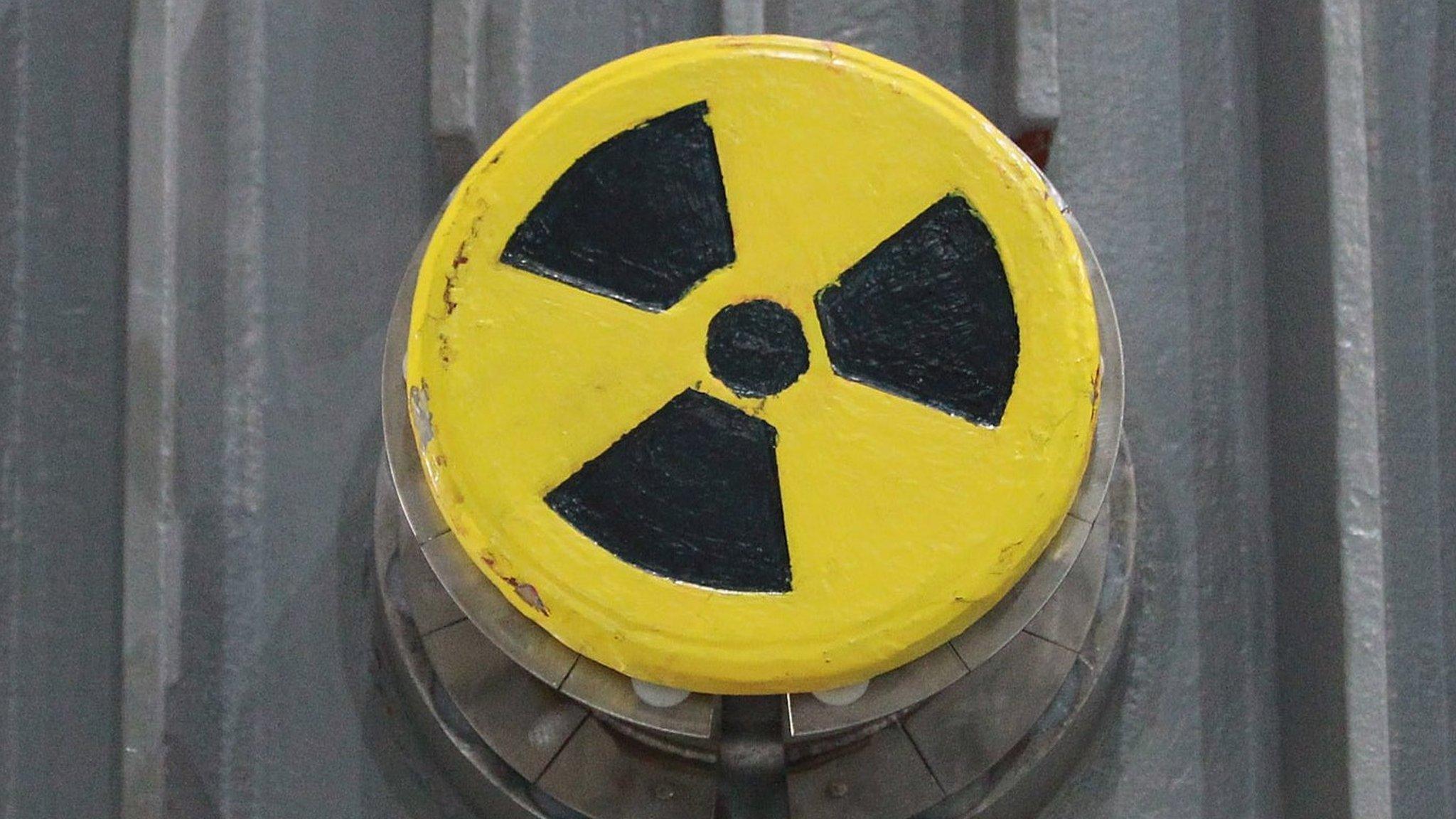 A symbol for radioactivity on a radioactively-contaminated container once used to transport nuclear fuel rods