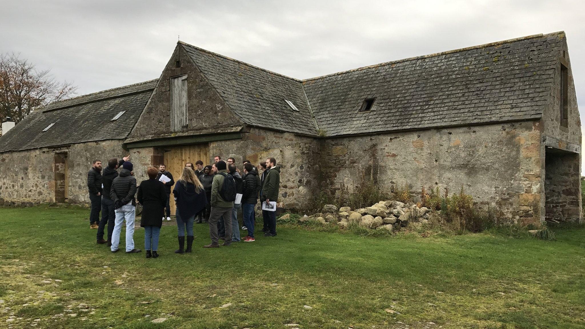 Students at site of mill