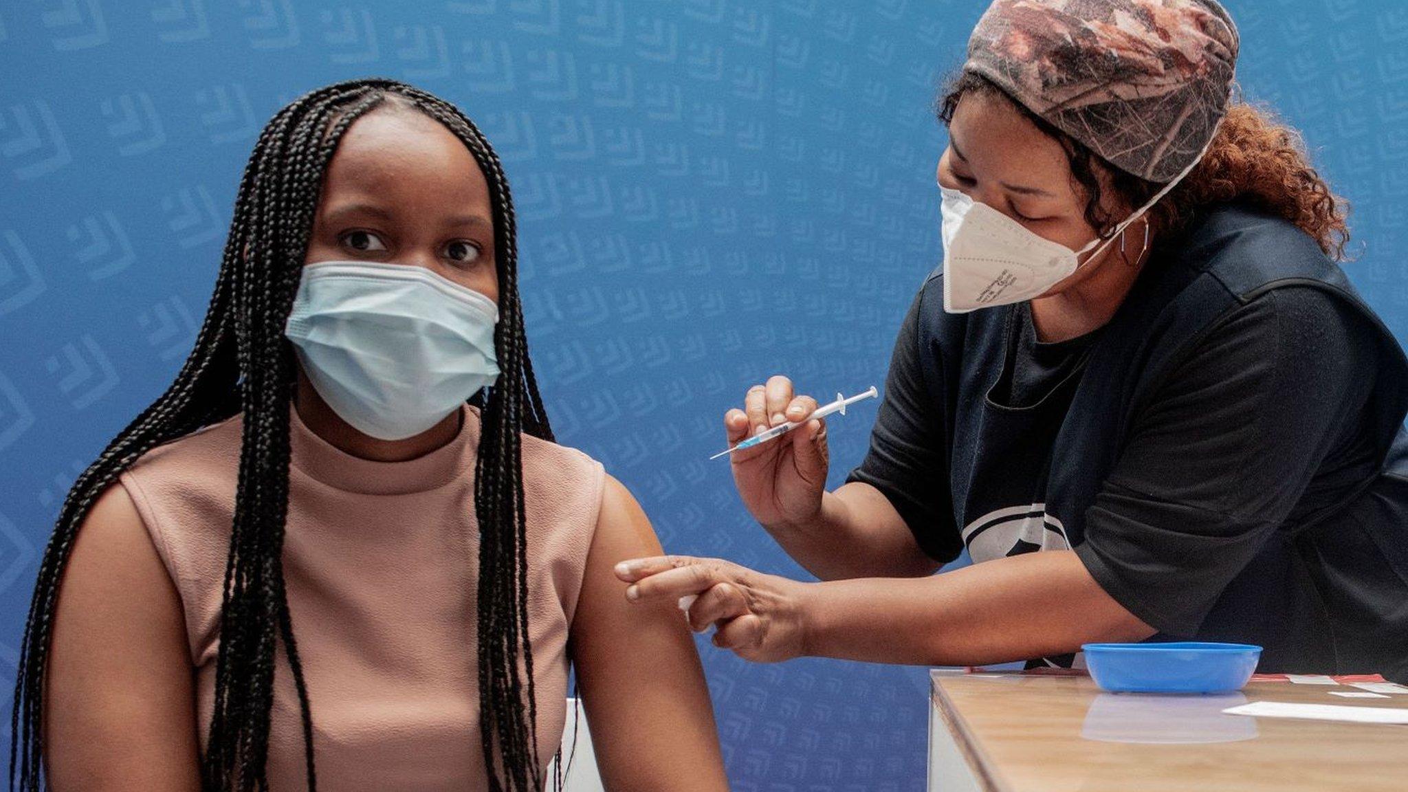 A woman being vaccinated in South Africa