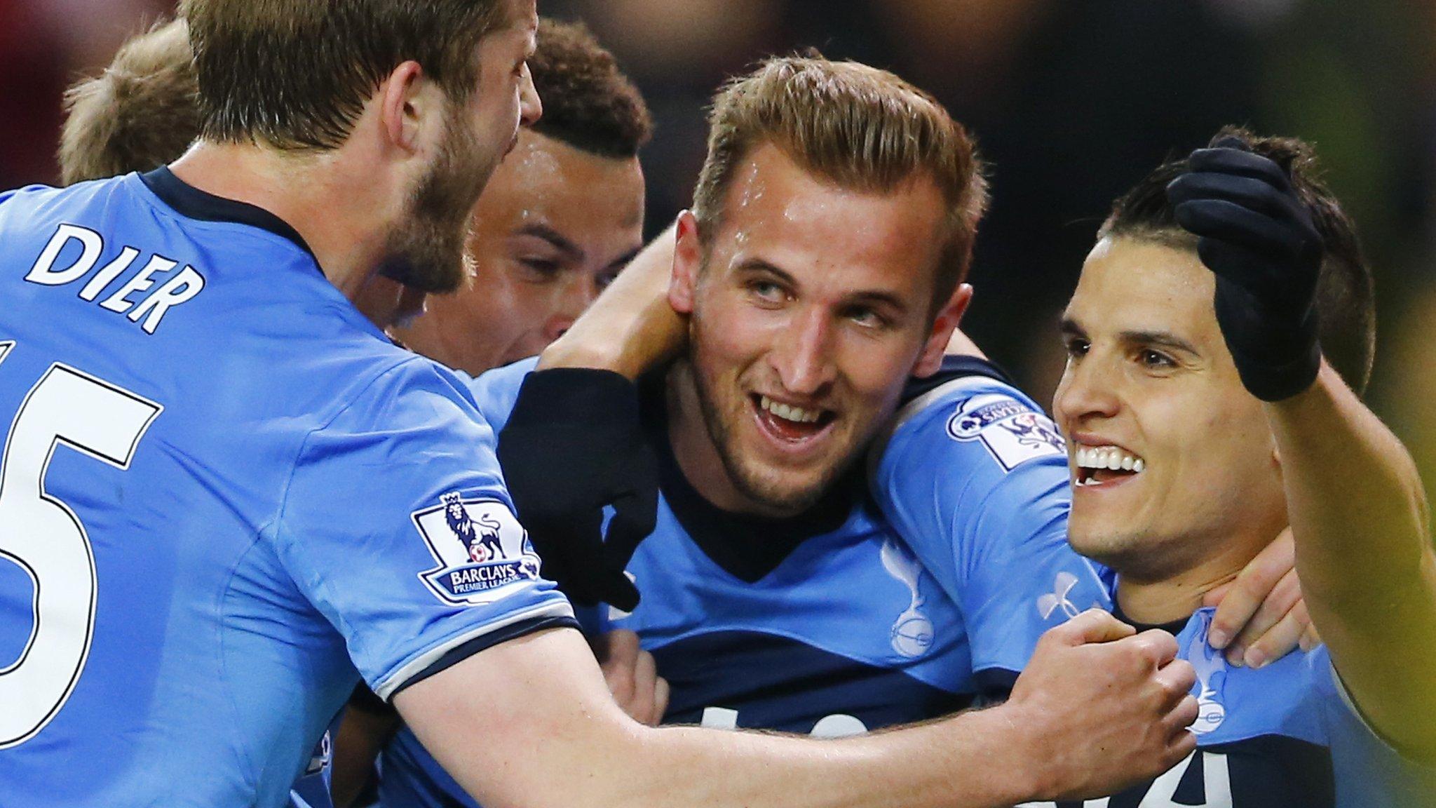 Tottenham players celebrate scoring against Stoke