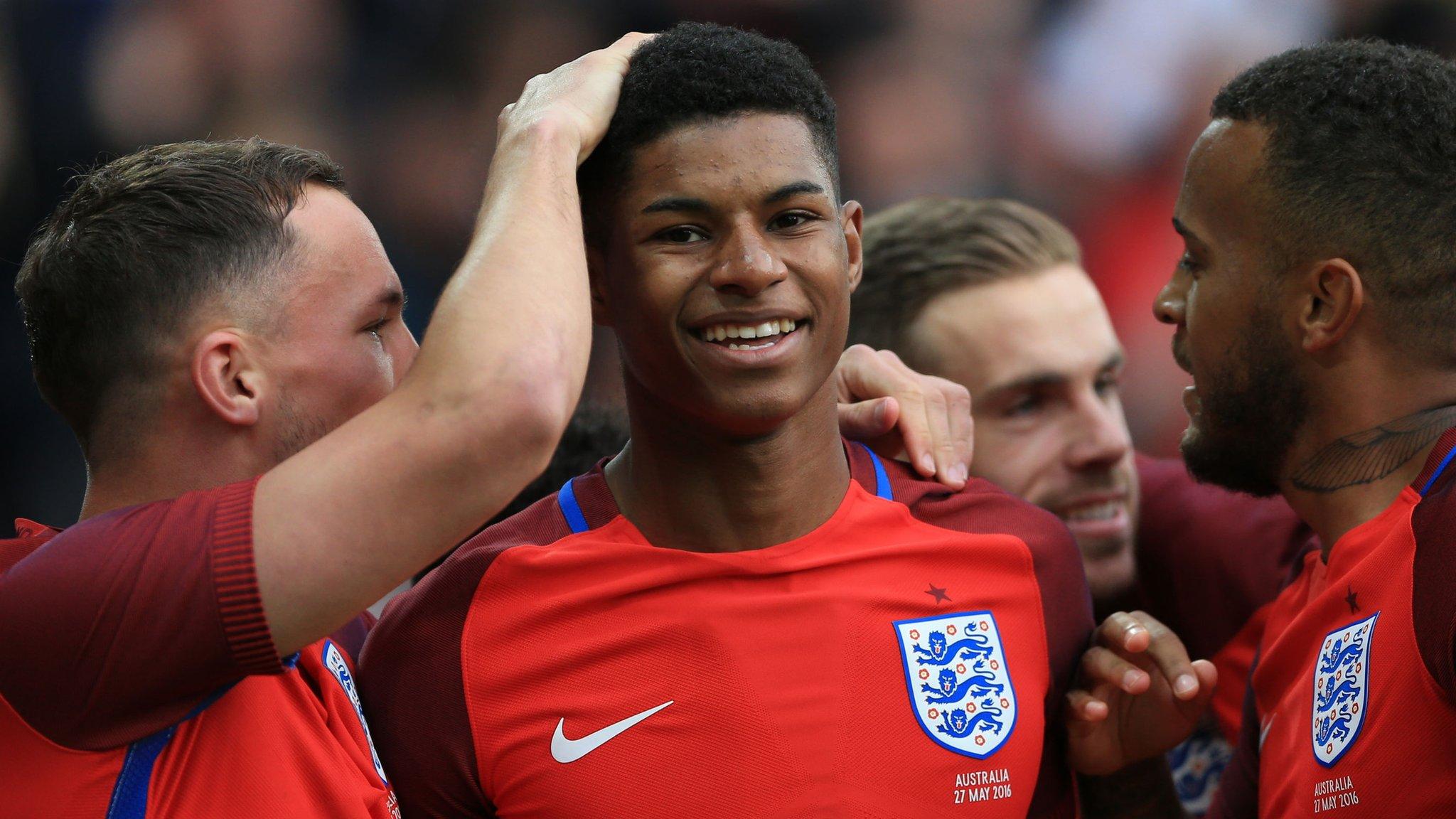 England striker Marcus Rashford (centre) is congratulated by team-mates after scoring against Australia