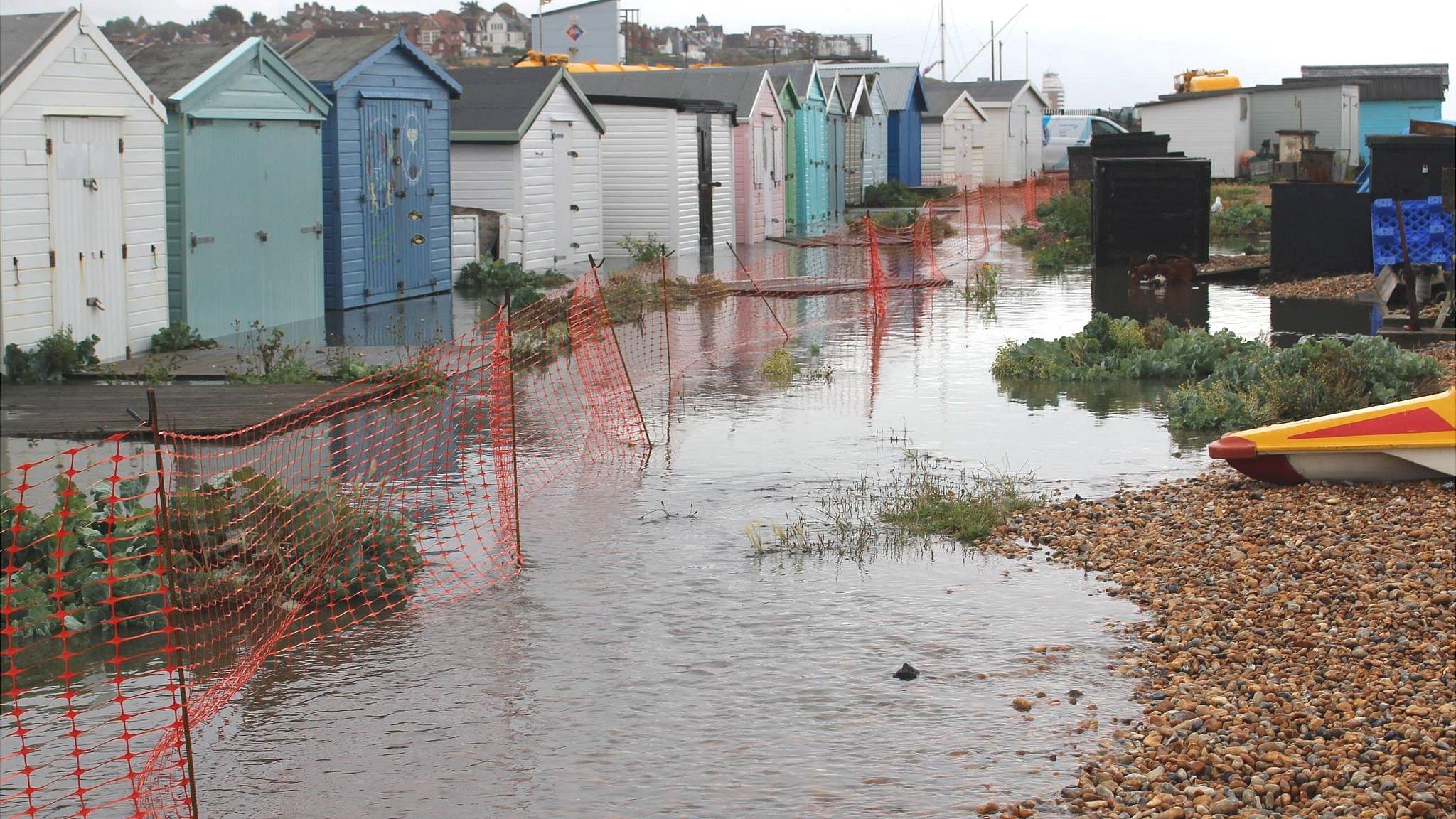 Flooded beach huts at Bulverhythe