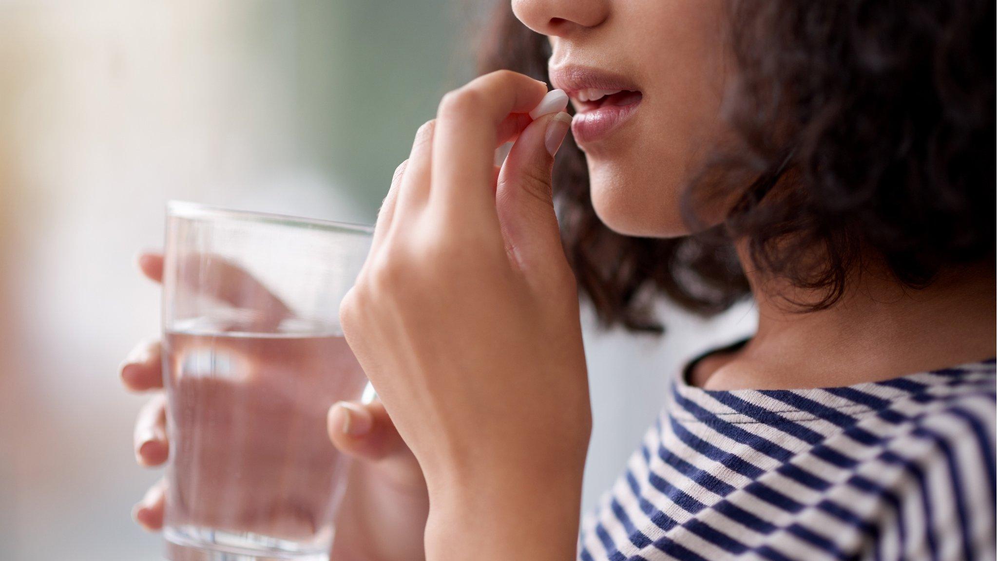 Woman taking drug