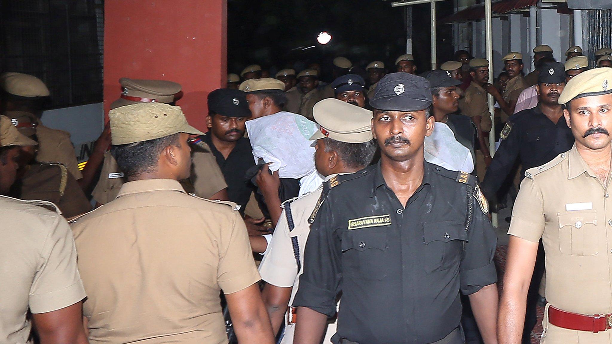 Police stand guard as the accused are brought to court in Chennai, India, July 17, 2018